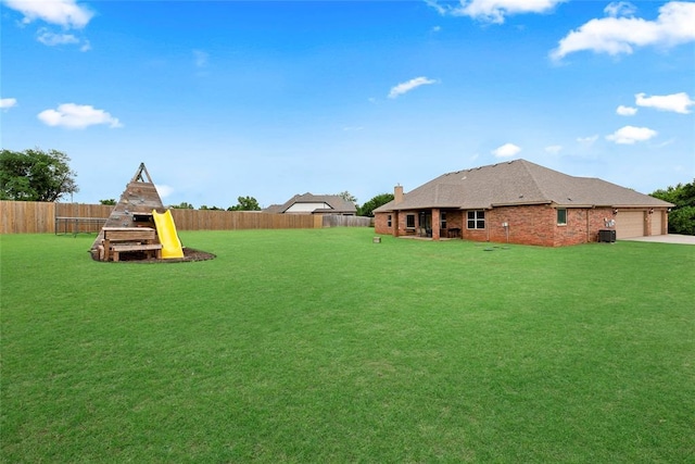 13640 Ridge View Ln, Edmond, OK 73025 - view of yard featuring a garage and concrete driveway