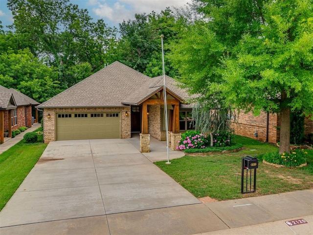 2120 Turtle Creek Dr, Norman, OK 73071 - view of front of property featuring driveway, an attached garage, brick siding, a front lawn, and roof with shingles