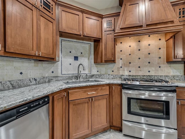 2120 Turtle Creek Dr, Norman, OK 73071 - kitchen featuring appliances with stainless steel finishes, a sink, and brown cabinetry