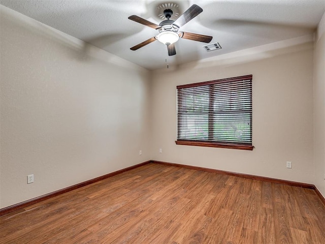 2120 Turtle Creek Dr, Norman, OK 73071 - empty room featuring baseboards, wood finished floors, and ceiling fan