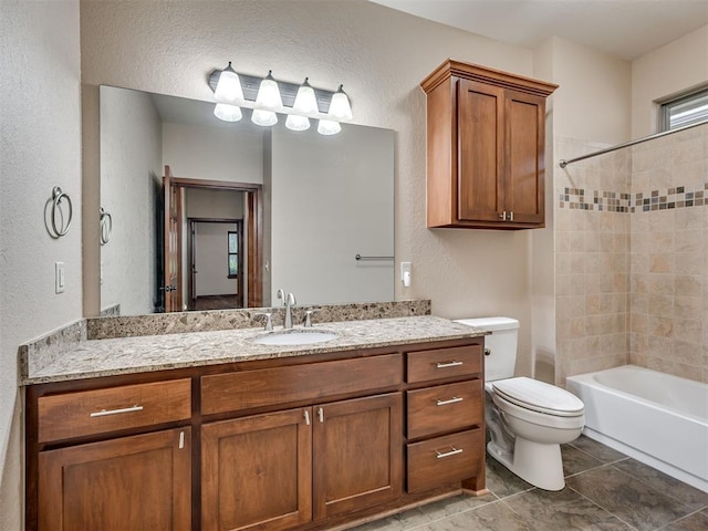2120 Turtle Creek Dr, Norman, OK 73071 - full bath with a textured wall, vanity, toilet, shower / tub combination, and tile patterned flooring