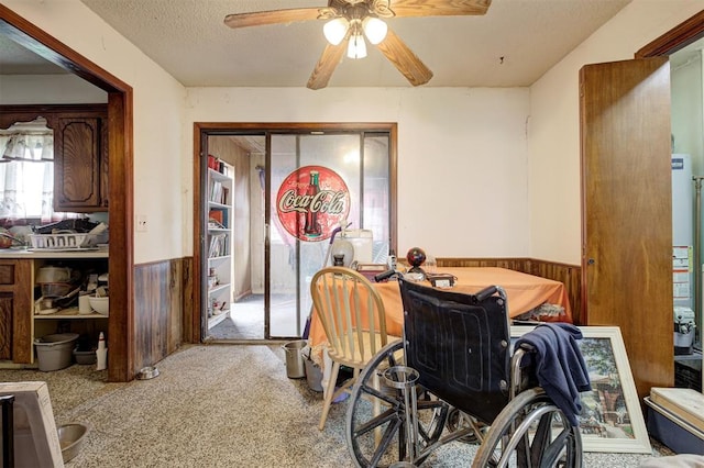 407 S Norman Ave, Moore, OK 73160 - carpeted dining area featuring wainscoting, a ceiling fan, and a textured ceiling