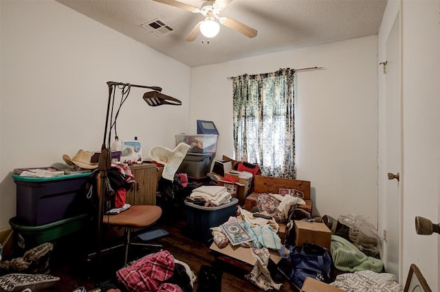 407 S Norman Ave, Moore, OK 73160 - bedroom with wood finished floors, a ceiling fan, and a textured ceiling