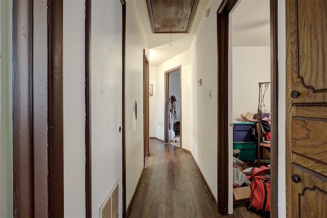 407 S Norman Ave, Moore, OK 73160 - corridor featuring attic access and dark wood-type flooring