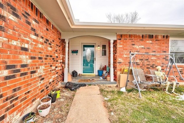 601 Oak Creek Dr, Yukon, OK 73099 - view of exterior entry featuring brick siding