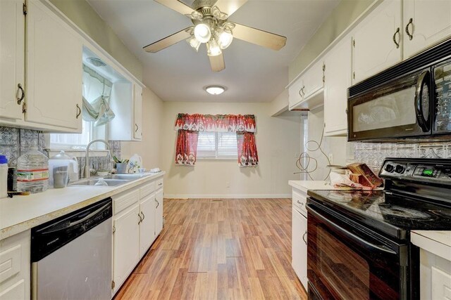 601 Oak Creek Dr, Yukon, OK 73099 - kitchen with black appliances, a sink, decorative backsplash, light countertops, and white cabinetry