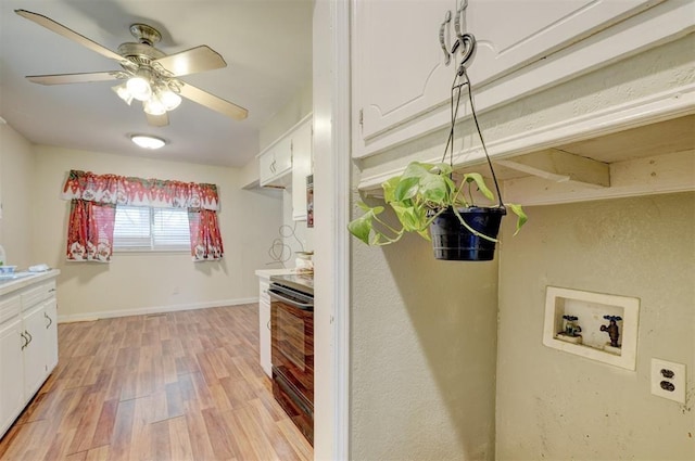 601 Oak Creek Dr, Yukon, OK 73099 - laundry room with light wood finished floors, ceiling fan, hookup for a washing machine, and baseboards