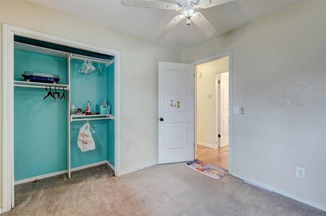 601 Oak Creek Dr, Yukon, OK 73099 - unfurnished bedroom featuring carpet, baseboards, a closet, and ceiling fan