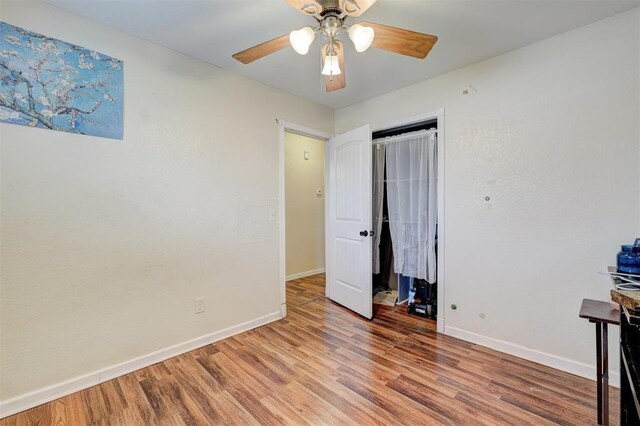 601 Oak Creek Dr, Yukon, OK 73099 - unfurnished bedroom with baseboards, light wood-style flooring, a closet, and ceiling fan