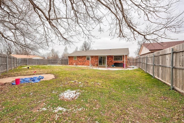 601 Oak Creek Dr, Yukon, OK 73099 - back of house with brick siding and a patio area