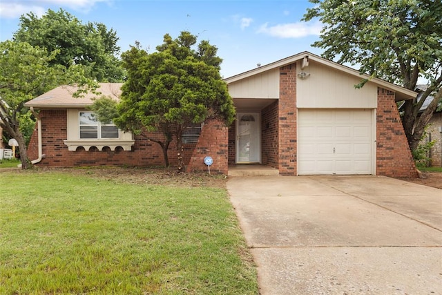 616 Willow Ridge Pl, Edmond, OK 73003 - view of front facade with brick siding, a front lawn, concrete driveway, and a garage