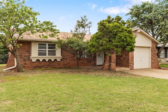616 Willow Ridge Pl, Edmond, OK 73003 - ranch-style house with an attached garage, brick siding, a front yard, and concrete driveway