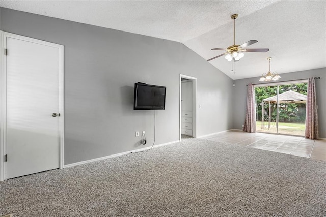 616 Willow Ridge Pl, Edmond, OK 73003 - unfurnished living room with a ceiling fan, lofted ceiling, carpet, a chandelier, and a textured ceiling