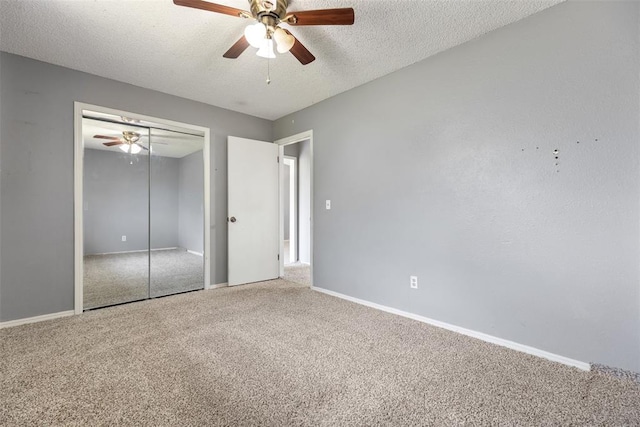 616 Willow Ridge Pl, Edmond, OK 73003 - unfurnished bedroom featuring carpet, a textured ceiling, a closet, baseboards, and a ceiling fan