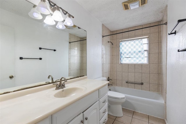 616 Willow Ridge Pl, Edmond, OK 73003 - bathroom featuring tile patterned floors, vanity, toilet, shower / tub combination, and a textured ceiling