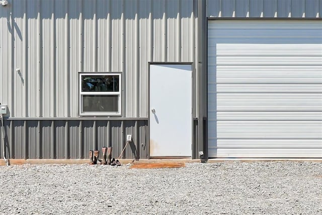 doorway to property with a garage