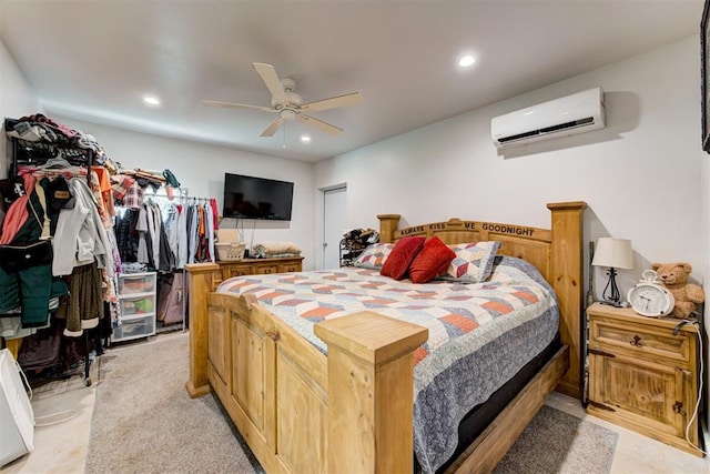 bedroom featuring a wall mounted air conditioner, recessed lighting, and ceiling fan