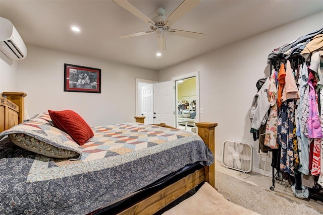 bedroom featuring a wall unit AC, recessed lighting, and ceiling fan