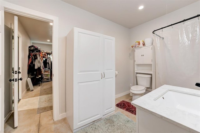 full bathroom featuring vanity, recessed lighting, a spacious closet, tile patterned flooring, and a shower with shower curtain
