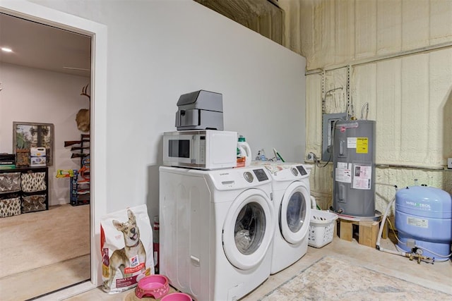 laundry area with electric water heater and washing machine and dryer
