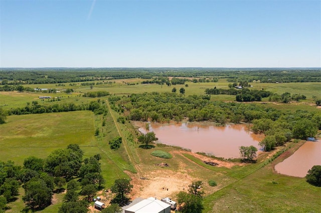aerial view of sparsely populated area featuring a nearby body of water