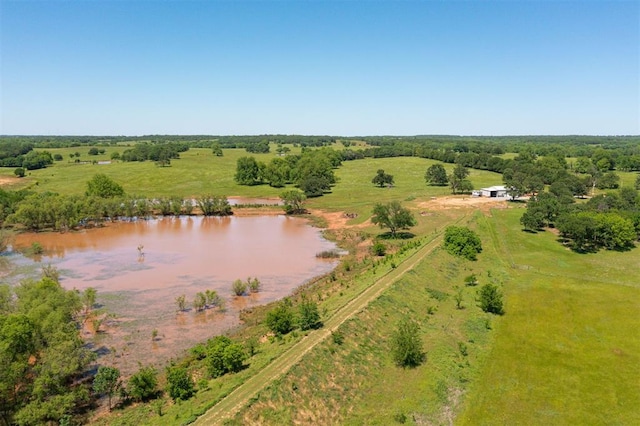 aerial view of sparsely populated area with a large body of water