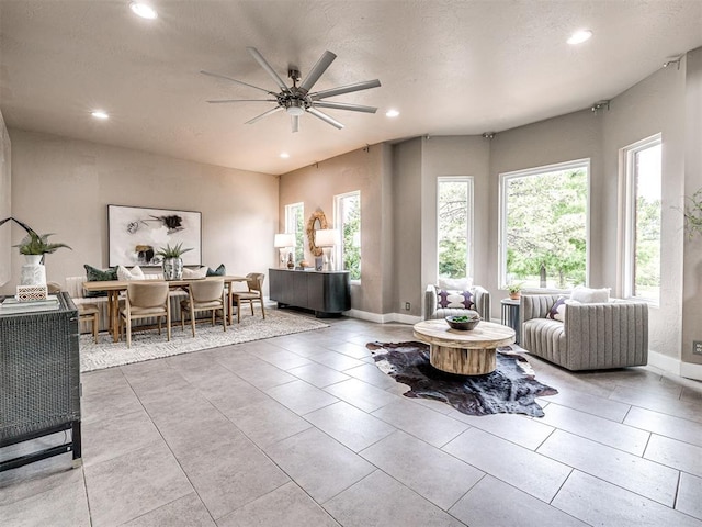 2113 Highlands Lndg, Edmond, OK 73013 - tiled living room with recessed lighting and a ceiling fan