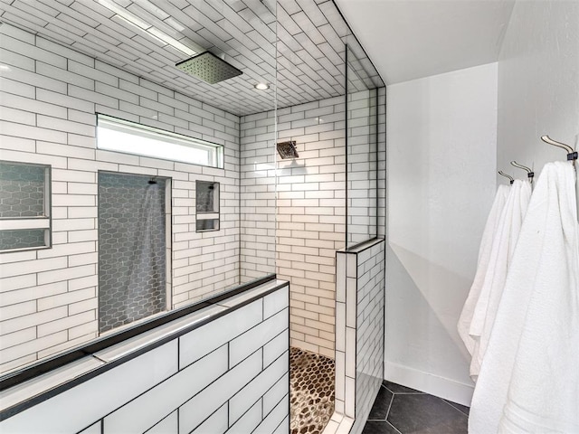2113 Highlands Lndg, Edmond, OK 73013 - bathroom with tiled shower and tile patterned floors