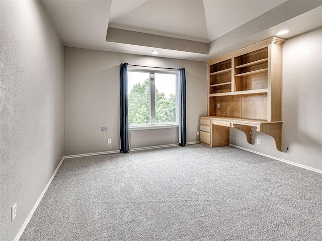 2113 Highlands Lndg, Edmond, OK 73013 - unfurnished office featuring light carpet, built in desk, and a textured wall