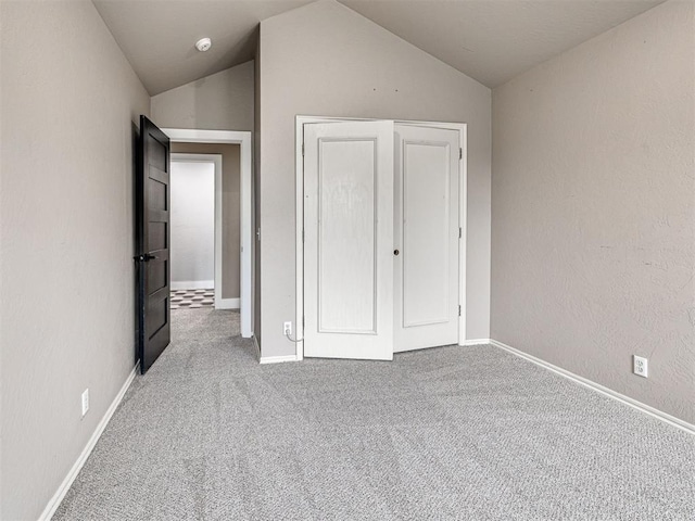2113 Highlands Lndg, Edmond, OK 73013 - unfurnished bedroom featuring carpet and lofted ceiling