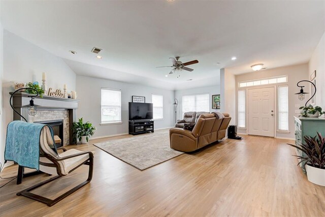 405 Bright Angel Trl, Edmond, OK 73003 - living area featuring light wood-style floors, ceiling fan, a brick fireplace, baseboards, and recessed lighting