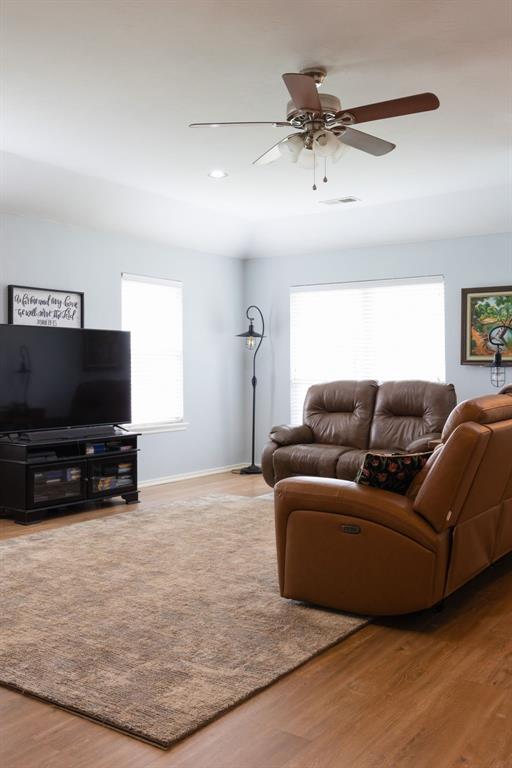 405 Bright Angel Trl, Edmond, OK 73003 - living area with wood finished floors, ceiling fan, recessed lighting, and baseboards
