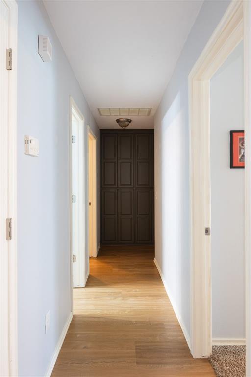 405 Bright Angel Trl, Edmond, OK 73003 - corridor featuring light wood finished floors and baseboards