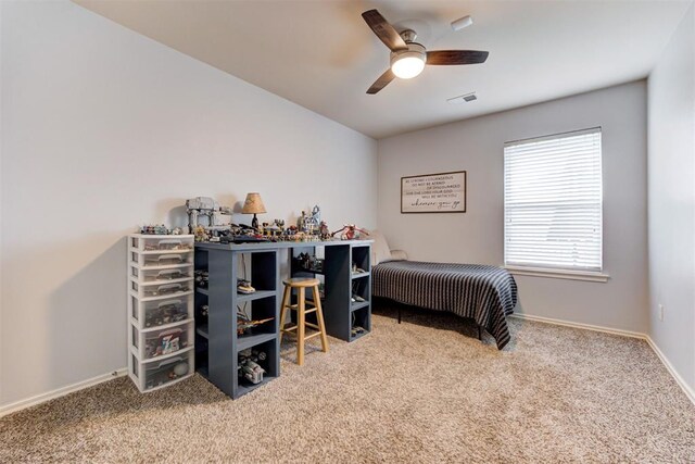 405 Bright Angel Trl, Edmond, OK 73003 - bedroom with carpet flooring, baseboards, and ceiling fan