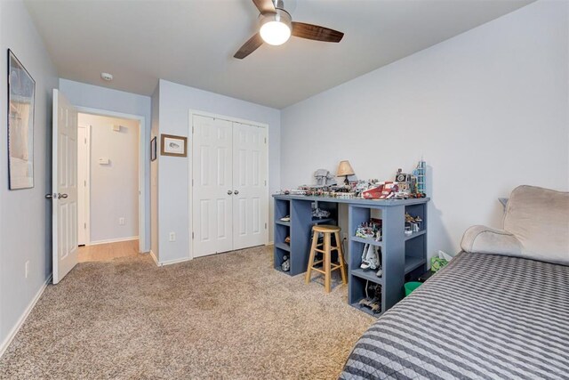 405 Bright Angel Trl, Edmond, OK 73003 - bedroom featuring carpet, baseboards, a closet, and ceiling fan