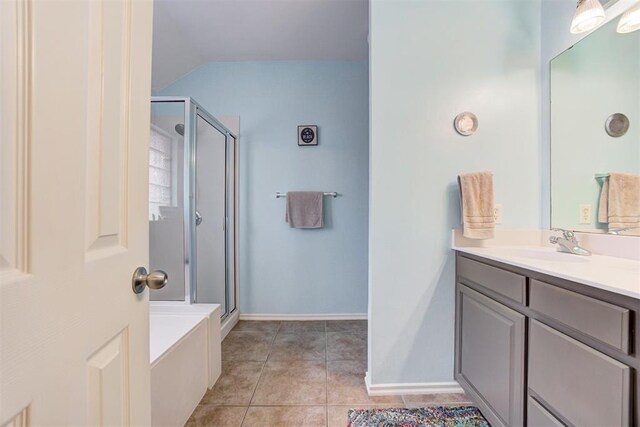 405 Bright Angel Trl, Edmond, OK 73003 - full bathroom featuring a stall shower, vanity, tile patterned flooring, lofted ceiling, and baseboards