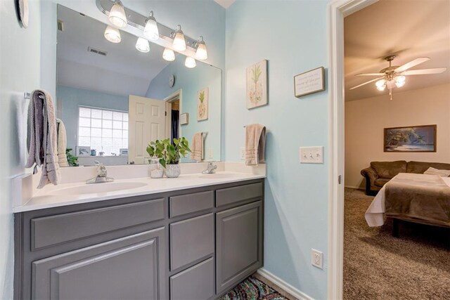 405 Bright Angel Trl, Edmond, OK 73003 - ensuite bathroom featuring double vanity and ceiling fan