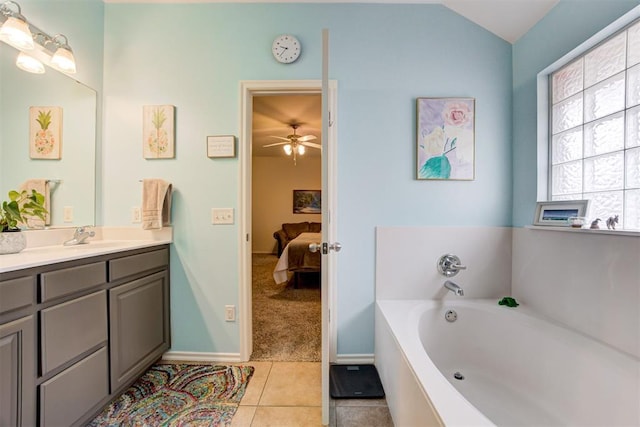 405 Bright Angel Trl, Edmond, OK 73003 - ensuite bathroom with vanity, a bath, tile patterned floors, lofted ceiling, and ceiling fan