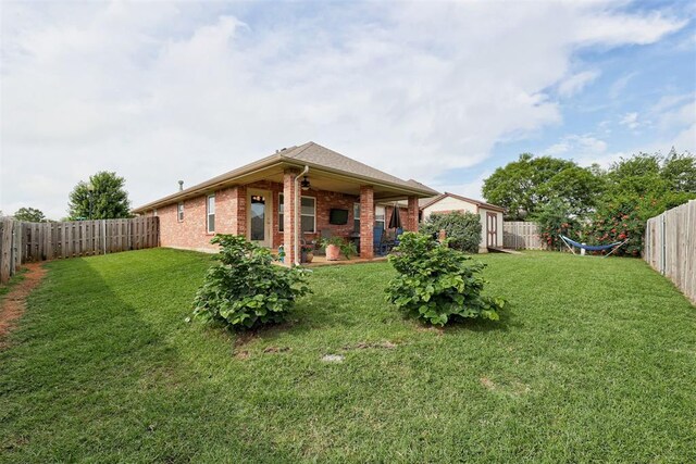 405 Bright Angel Trl, Edmond, OK 73003 - rear view of property with brick siding and a patio area