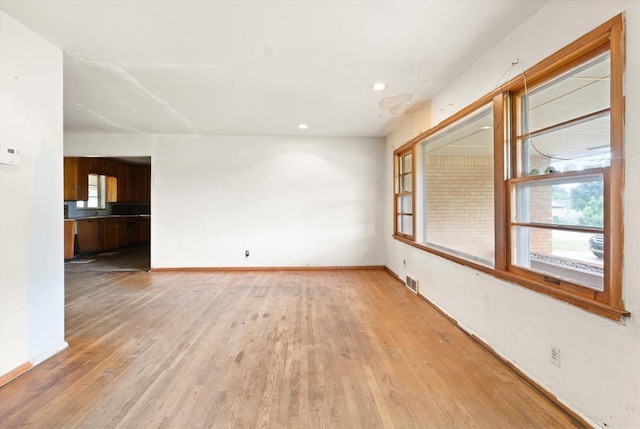 5321 S Douglas Ave, Oklahoma City, OK 73109 - spare room with light wood-type flooring, baseboards, and recessed lighting