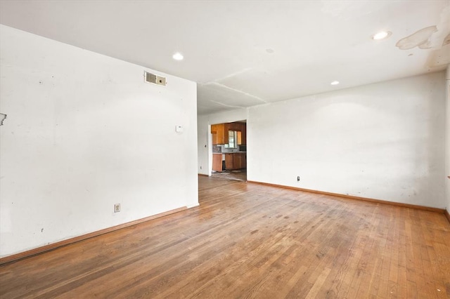 5321 S Douglas Ave, Oklahoma City, OK 73109 - empty room featuring light wood finished floors, baseboards, and recessed lighting