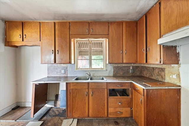 5321 S Douglas Ave, Oklahoma City, OK 73109 - kitchen with a sink, brown cabinetry, and decorative backsplash