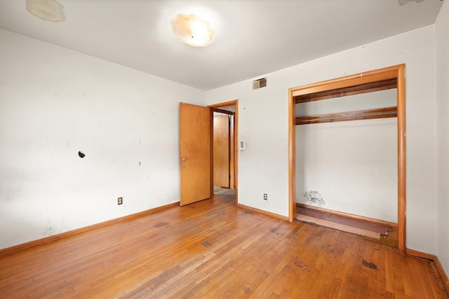 5321 S Douglas Ave, Oklahoma City, OK 73109 - unfurnished bedroom featuring hardwood / wood-style flooring, baseboards, and a closet