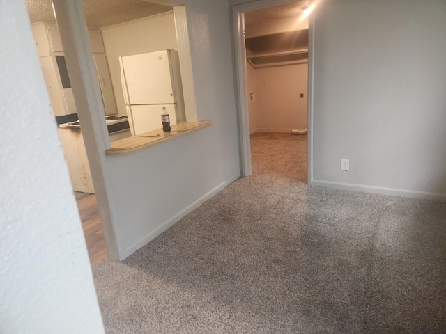 1003 E Whittaker St, Shawnee, OK 74801 - corridor with carpet flooring and baseboards