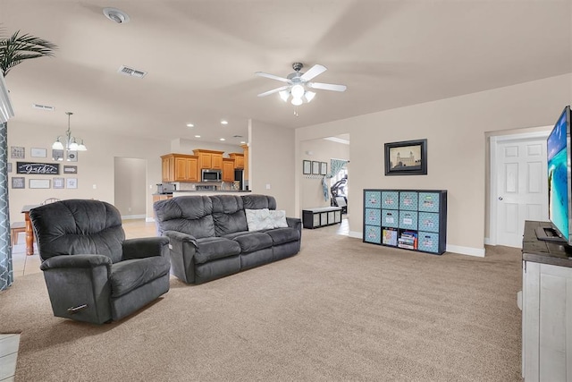 1204 Sheryl Ln, Altus, OK 73521 - living area with light colored carpet, ceiling fan, a chandelier, and recessed lighting