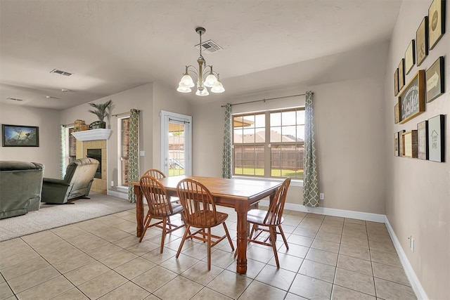 1204 Sheryl Ln, Altus, OK 73521 - dining space featuring light tile patterned floors, a chandelier, and baseboards