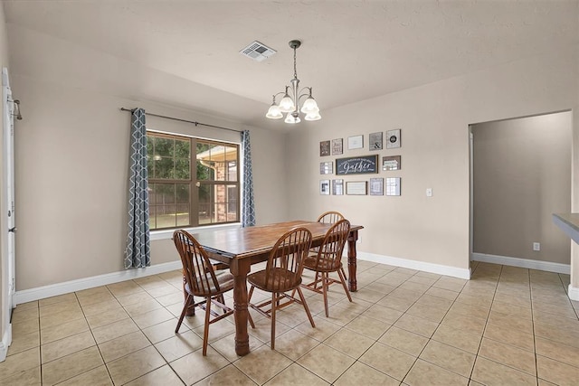 1204 Sheryl Ln, Altus, OK 73521 - dining space featuring light tile patterned floors, a chandelier, and baseboards