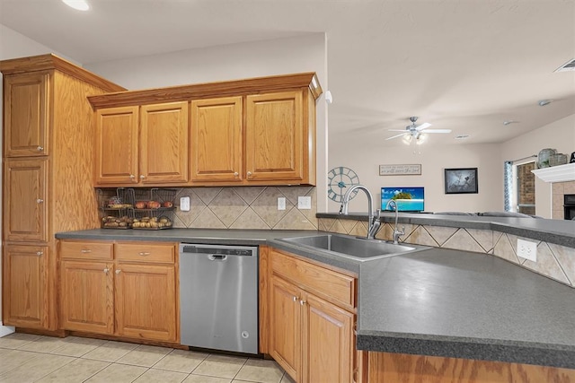 1204 Sheryl Ln, Altus, OK 73521 - kitchen featuring dishwasher, a sink, dark countertops, and decorative backsplash