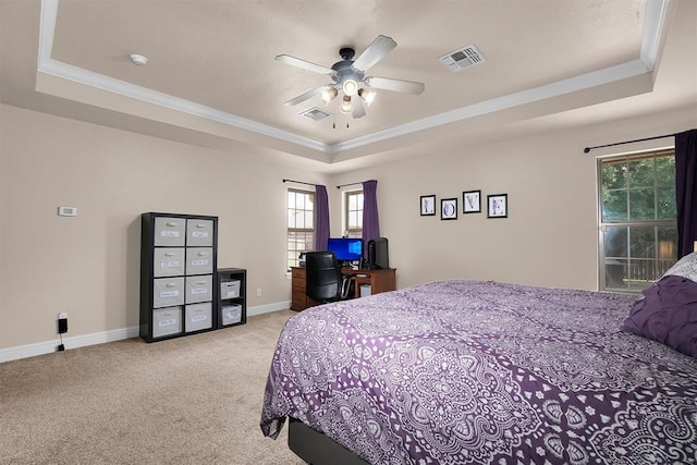 1204 Sheryl Ln, Altus, OK 73521 - bedroom featuring a tray ceiling, ornamental molding, light colored carpet, baseboards, and ceiling fan