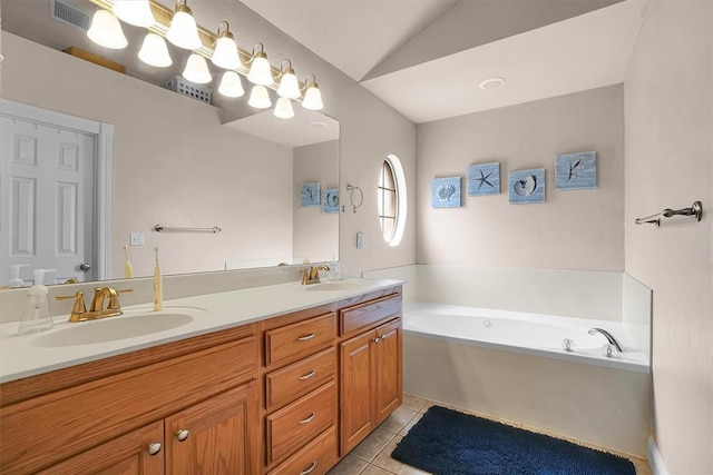1204 Sheryl Ln, Altus, OK 73521 - bathroom with double vanity, tile patterned floors, a bath, and lofted ceiling